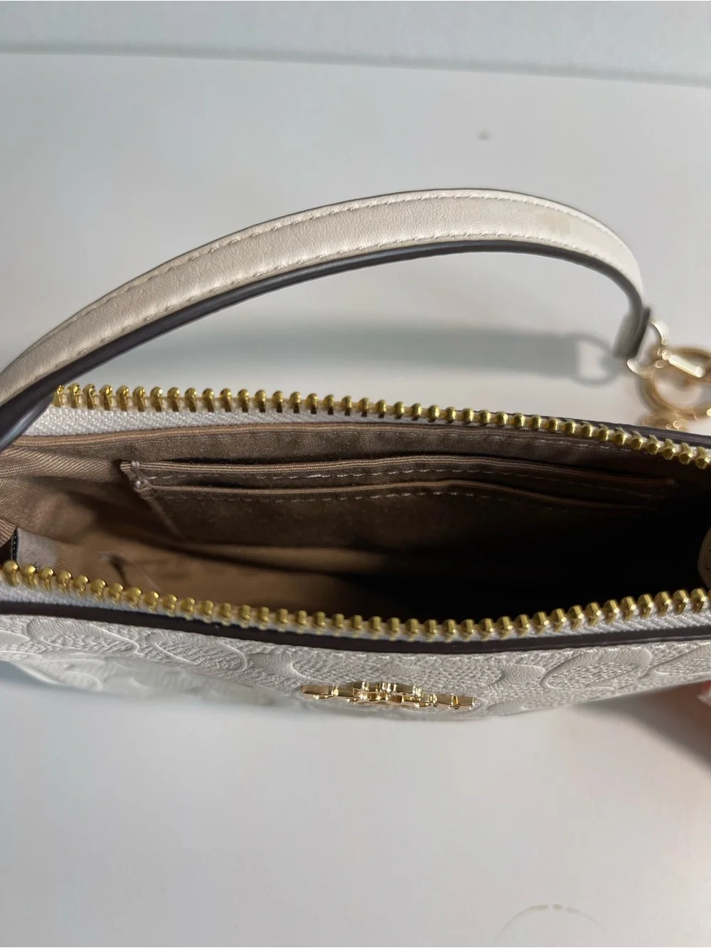 Coach Cream Signature Embossed Leather Mini Wristlet with Gold Accents